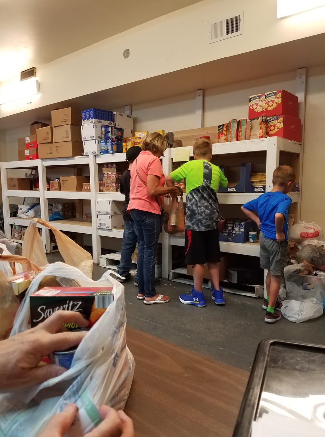 Family standing at the food pantry