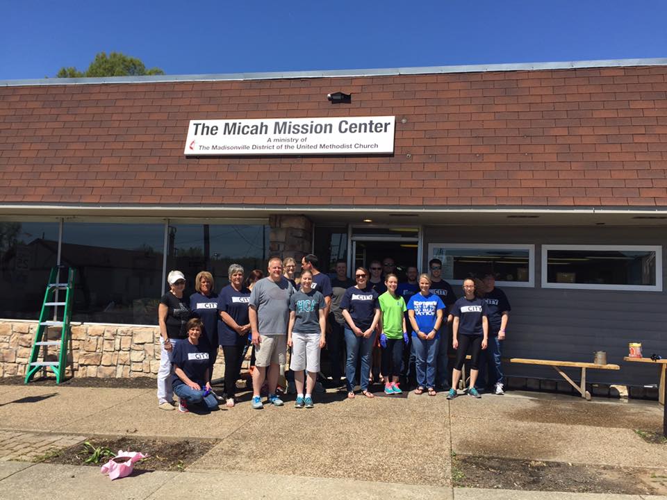 group photo standing in front of building